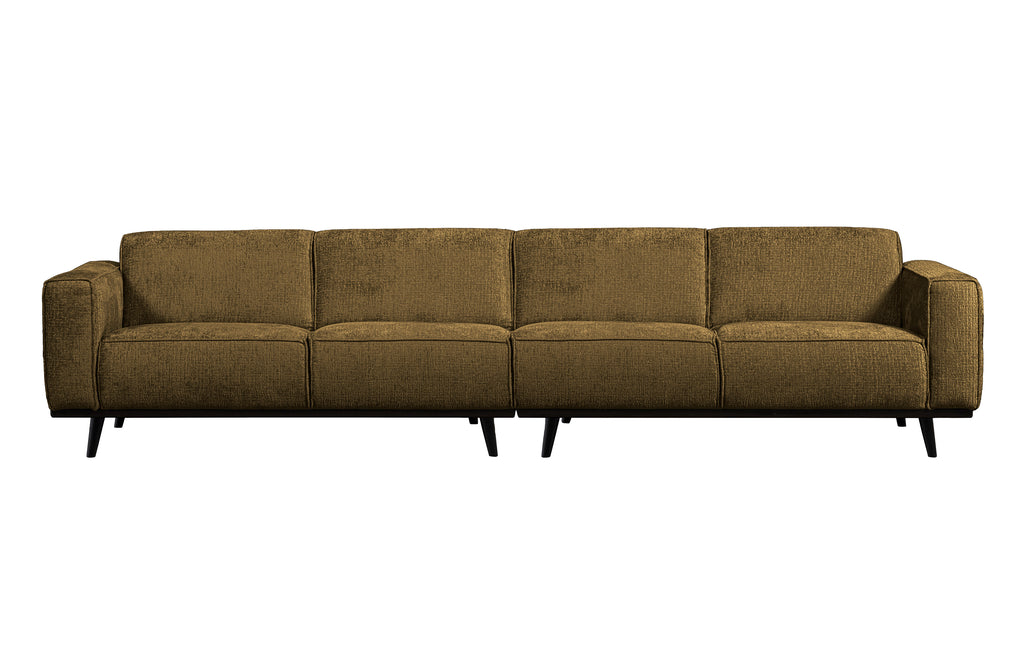 žalvario spalvos sofa