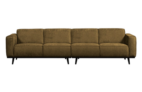 žalvario spalvos sofa